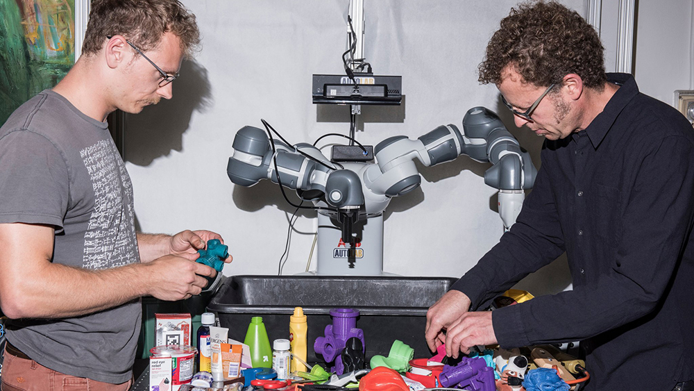 Jeff Mahler, left, and Ken Goldberg have studied ways to help robots figure out tasks on their own at the University of California, Berkeley. Credit Jason LeCras for The New York Times