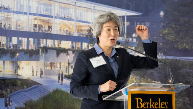 Professor King Liu speaking behind a podium